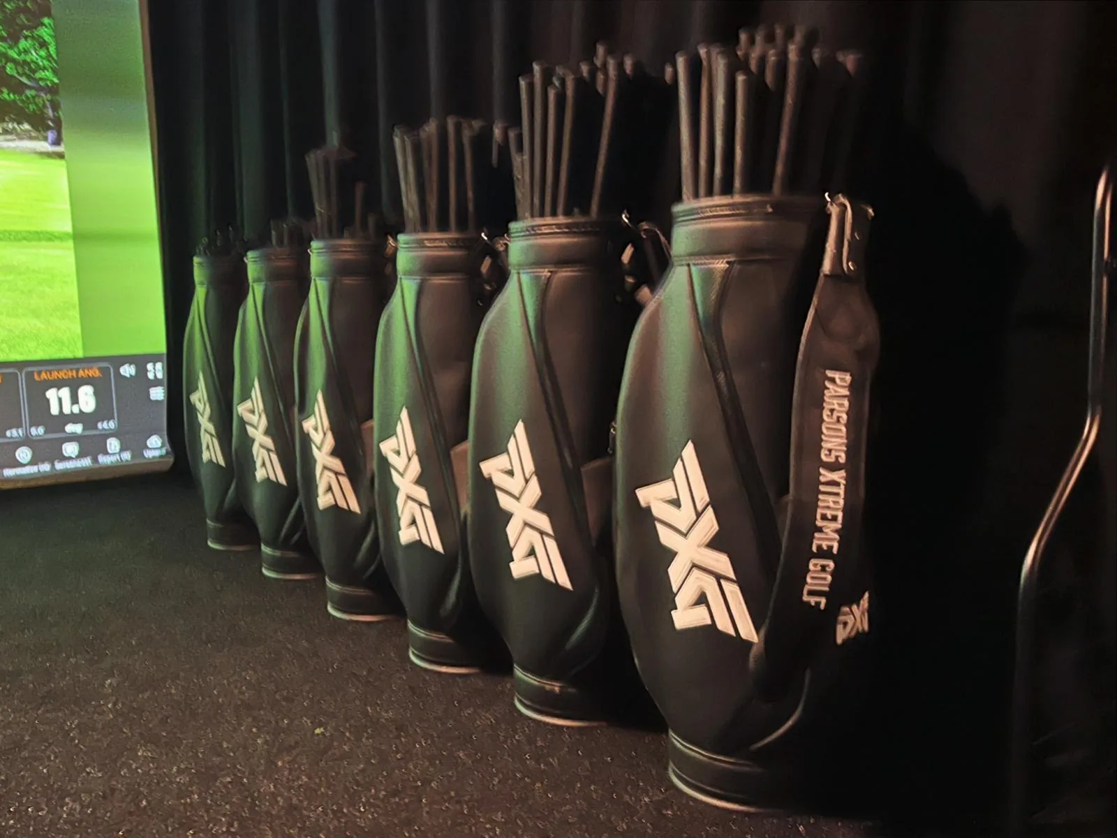 PXG irons lined up for a club fitting at Fliers Indoor Golf, Liverpool